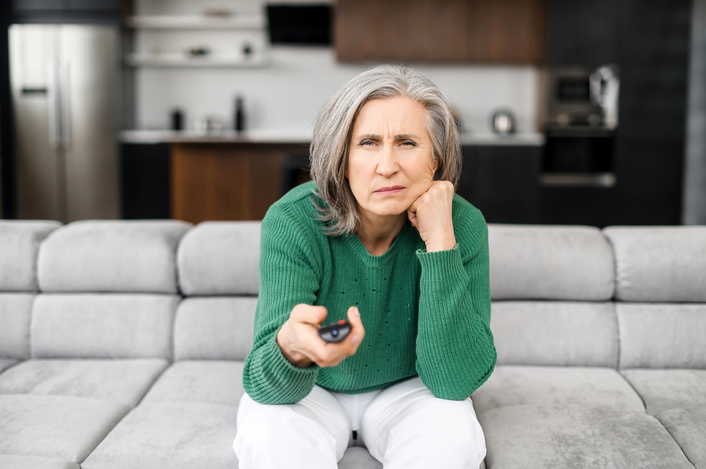 bore retiree woman watching tv