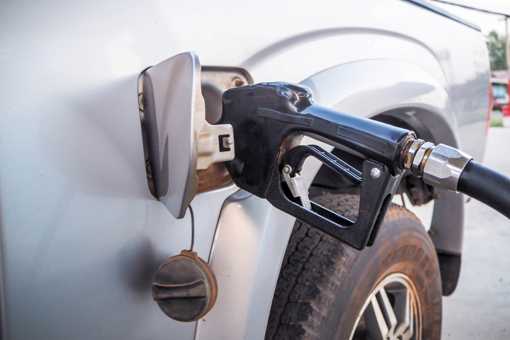 filling up an economy car at gas station