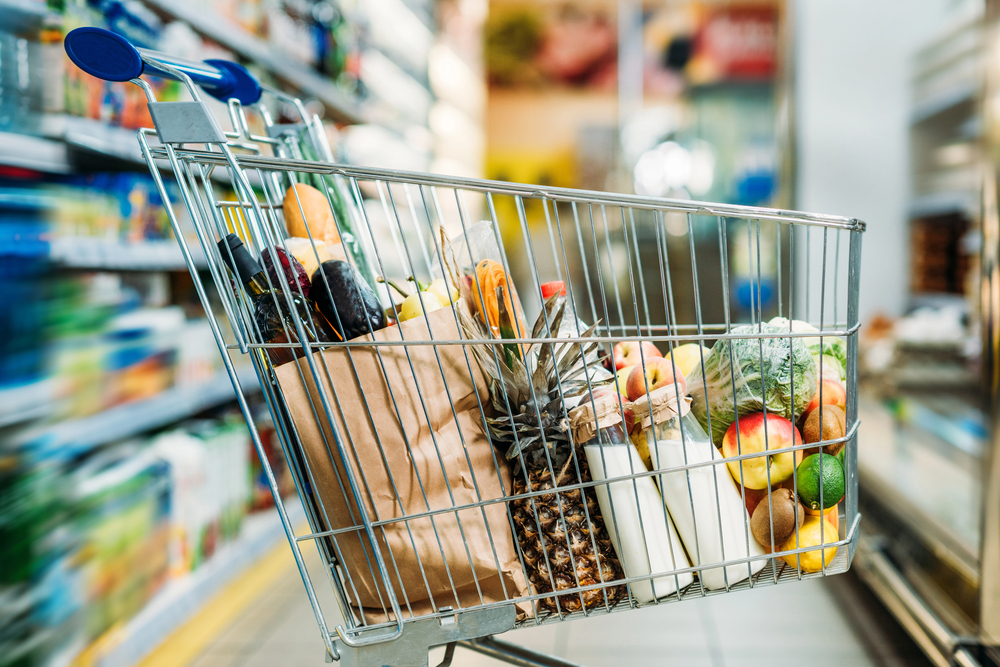 grocery cart filled with healthy food